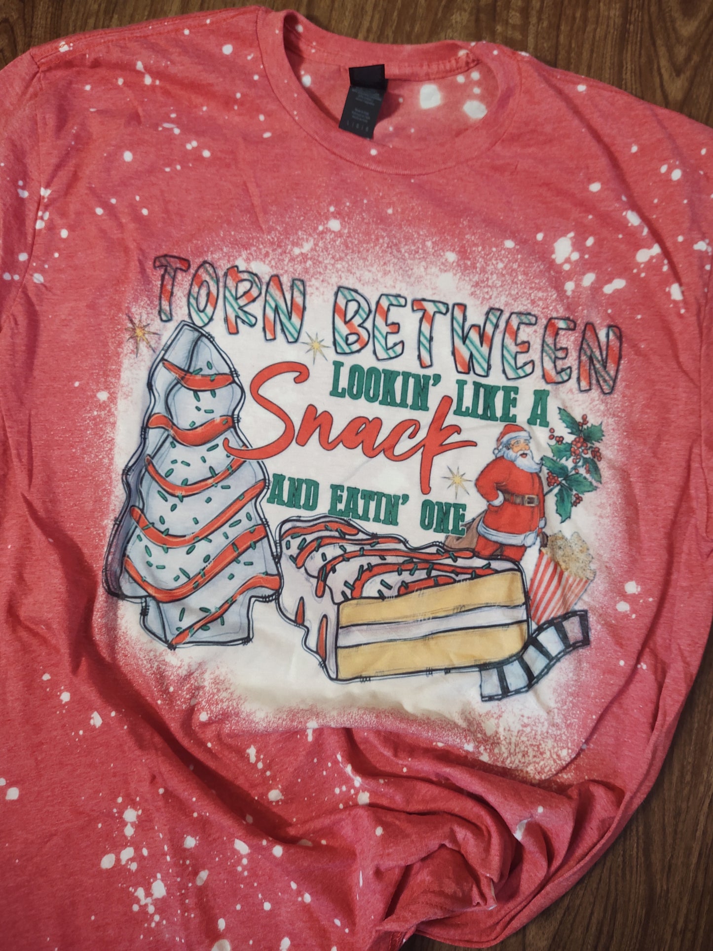 RTS Torn Between Lookin' Like a Snack and Eatin One Funny Bleached Christmas T-Shirt with Santa and Christmas Tree Cakes