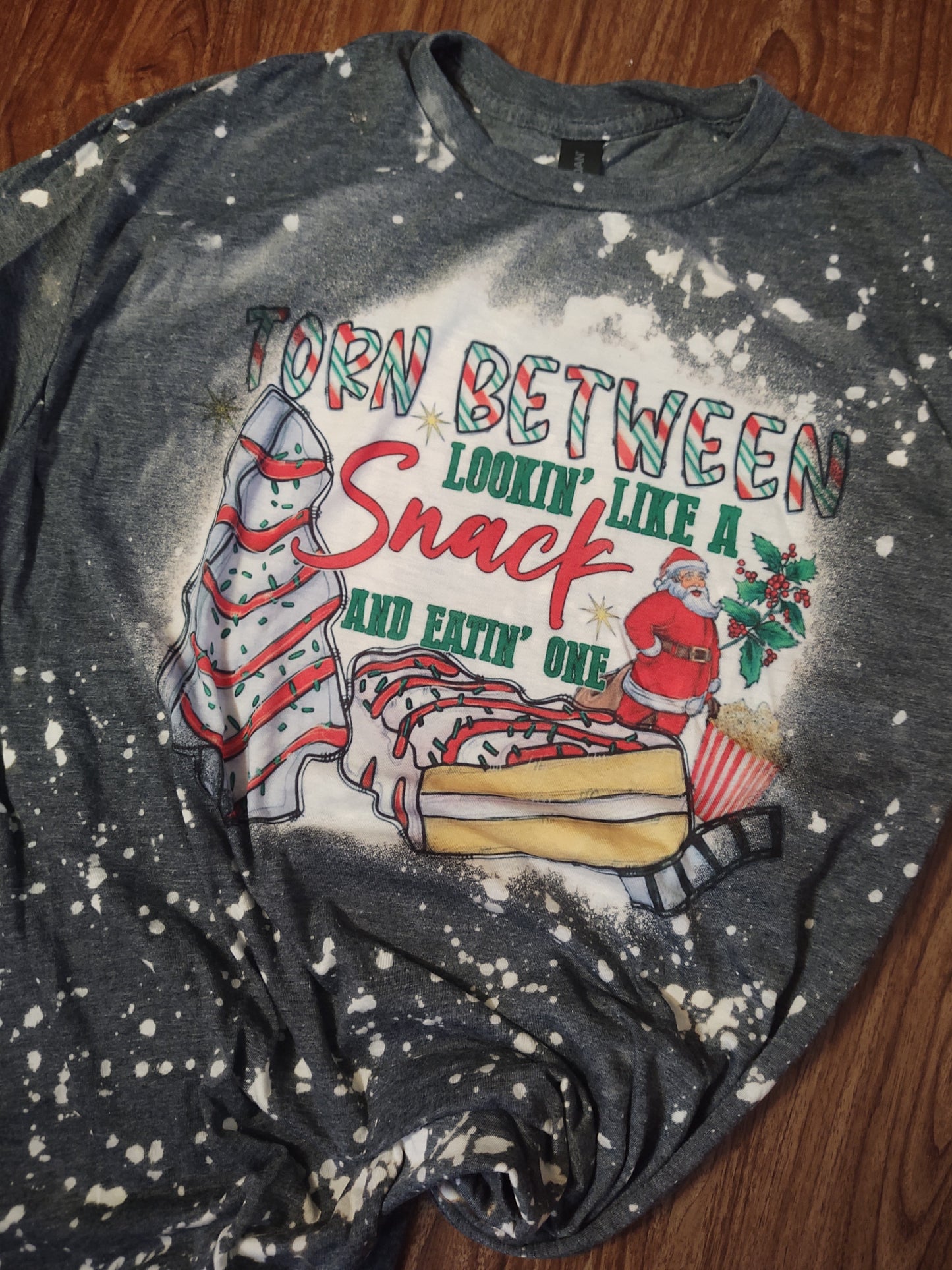 RTS Torn Between Lookin' Like a Snack and Eatin One Funny Bleached Christmas T-Shirt with Santa and Christmas Tree Cakes